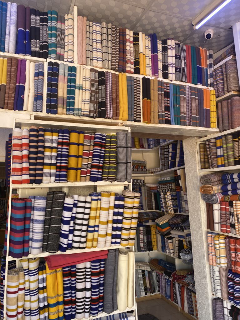 Shelves and shelves of coulourful striped Faso dan Fani